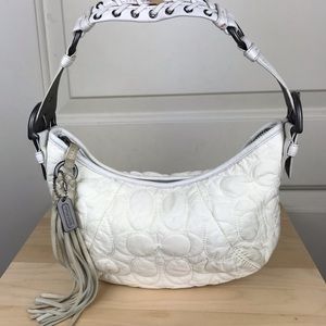 Coach Mini nylon bag with leather strap and tassel